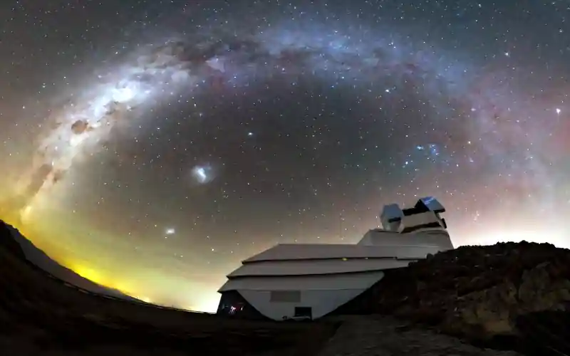 This image from February 2026 shows the Vera Rubin Observatory at Cerro Pachon in Chile, with the Milky Way arching overhead. Designed to detect small changes in the night sky, the VRO and its decade-long Legacy Survey of Space and Time will help us discover more imminent impactors, alerting other telescopes and determining where they strike Earth. Credit: NSF–DOE Rubin Observatory/NOIRLab/SLAC/AURA/P. Lago